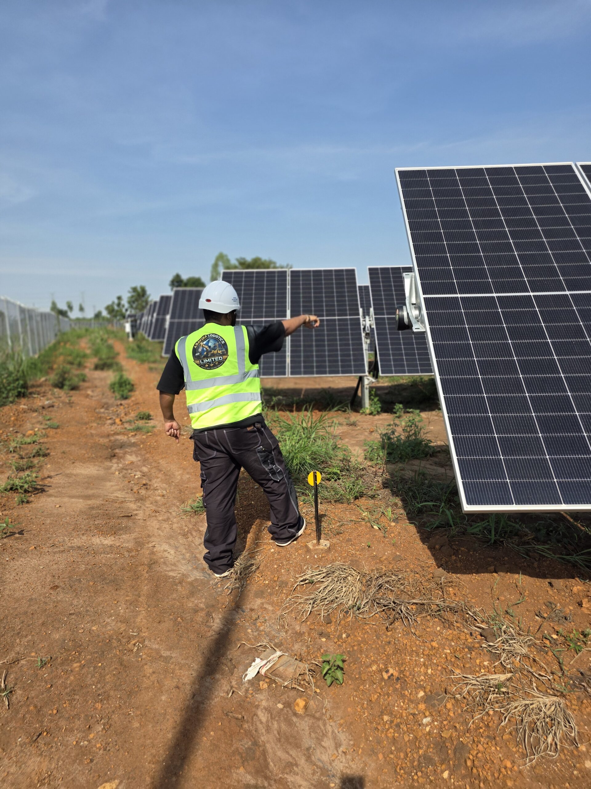 Abayira technician inspecting solar photovoltaic panels